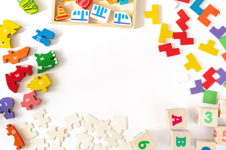 Colorful baby kids toys on white background. Frame from developing colorful blocks, cars and...