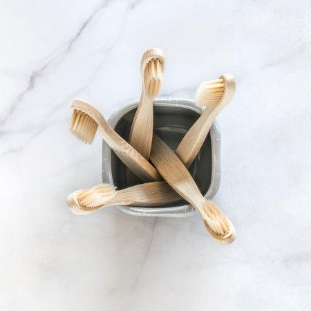 Composition with biodegradable bamboo toothbrushes on marble background. Sustainable, zero waste,...