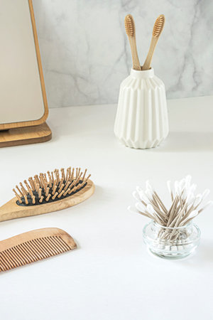 Zero waste concept. Set of eco friendly bathroom accessories - bamboo toothbrushes, cotton buds,...