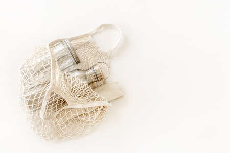 Eco friendly accessories - bamboo cutlery, eco bag, reusable water bottle. Zero waste, plastic free concept, sustainable lifestyle. Top view, flat lay.の写真素材