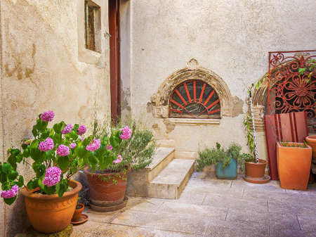 Narrow old street and yard in Sibenik city, Croatia, medieval zoneの写真素材