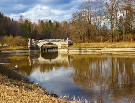 Spring landscape with a bridge on the sunny day. The Park of Pavlovsk. Saint Petersburg. Russia.の写真素材