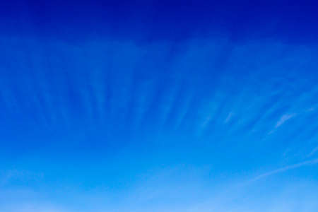 Blue sky background with white cloudsの写真素材