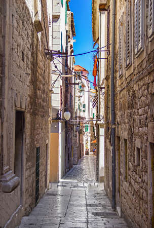 Narrow old streets and yards in Sibenik city, Croatia, medieval zoneの写真素材