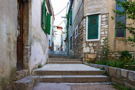 Narrow old streets and yards in Sibenik city, Croatia, medieval zoneの写真素材