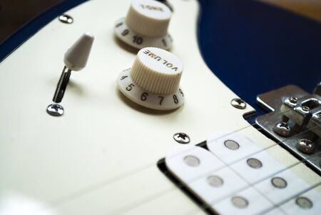 Blue-white electric guitar close-up. Itemsの写真素材