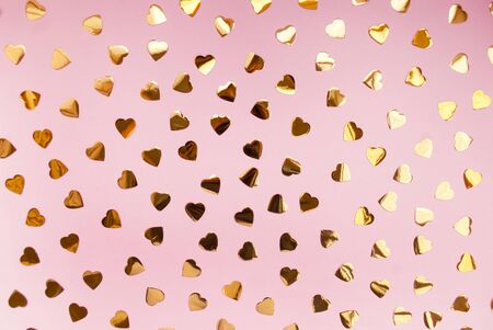 Round silver confetti on a pink background. Place for text. Festive background. Event. Birthday Conception. Flat lay. Top view.の写真素材