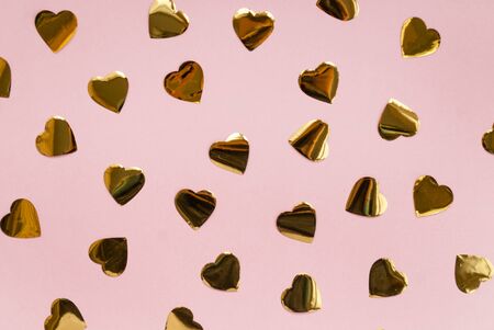 Round silver confetti on a pink background. Place for text. Festive background. Event. Birthday Conception. Flat lay. Top view.の写真素材