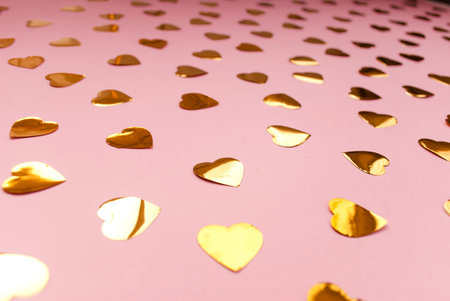 Round silver confetti on a pink background. Place for text. Festive background. Event. Birthday...