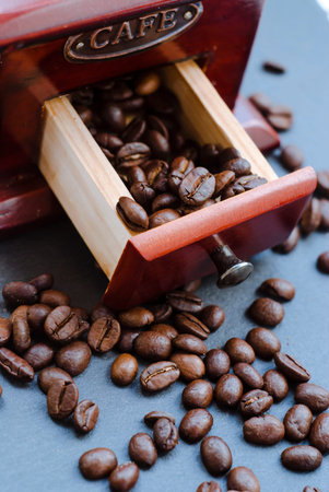 Coffee beans on a dark table, close-up