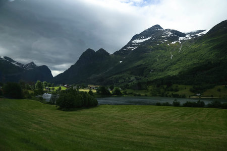 Beautiful landscape in Norway. Snowy moutain and fjord