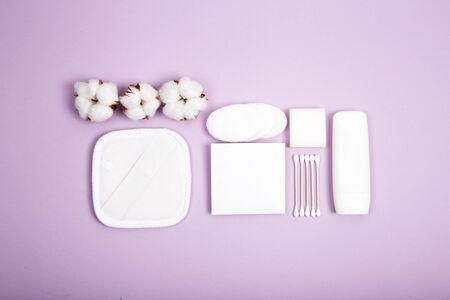 Beauty and spa concept. Flat lay composition with cosmetic products and cotton on color backgroundの写真素材