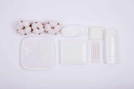 Beauty and spa concept. Flat lay composition with cosmetic products and cotton on white backgroundの写真素材