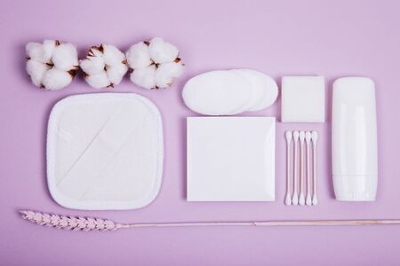 Beauty and spa concept. Flat lay composition with cosmetic products and cotton on color backgroundの写真素材