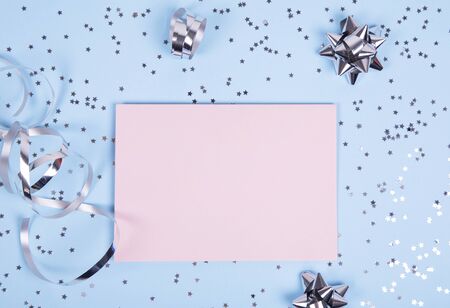 Close up of a pink greeting card with decoration on blue backgroundの写真素材