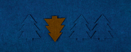 Christmas composition pattern background of Christmas trees on blue background. Christmas and New...