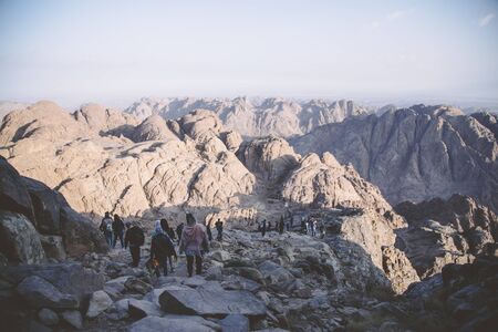 Mount Sinai, Sharm Ash Sheikh, Egypt - 25 October 2017. Pilgrims and tourists on the pathway from the Mount Sinai peak Holy Mount Moses in early morning.のeditorial素材