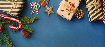 Christmas or New Year blue banner, Xmas black board framed with season decorations, space for a text, view from above.の写真素材