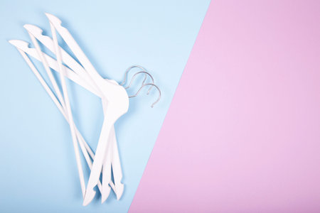 White wooden clothes hanger on colorfull backgroundの写真素材