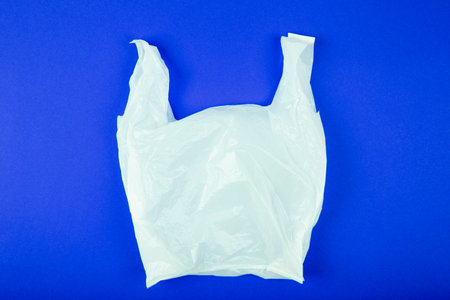 Disposable plastic bag on blue background, clipping path included