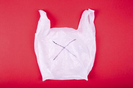 Disposable plastic bag on red background, clipping path includedの写真素材