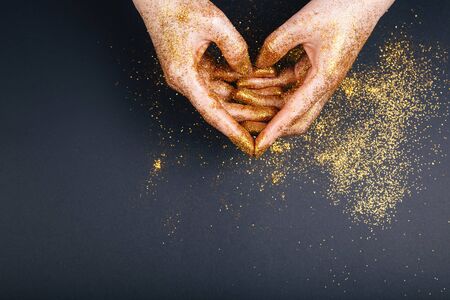 Female hand showing heart shape gesture. Fastive background, space for textの写真素材