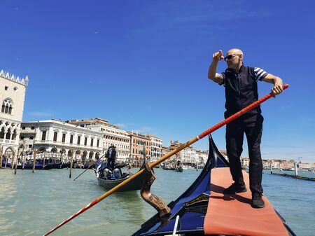 May 6, 2019 - Venice, Italy. Gondolier on a gondola on the Grand Canal in Venice in sunny dayのeditorial素材