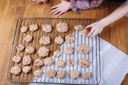 Strawberry Chocolate Chip Cookies. Kids hands taking homemade buscuitの写真素材