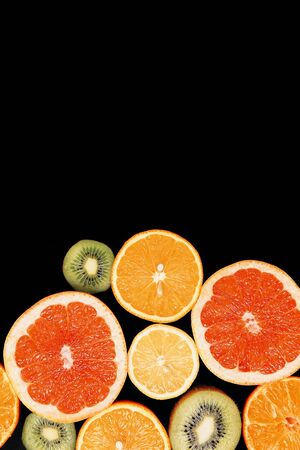 Citrus fruits background orange lemon grapefruit mandarin kiwi. Flatlay compositionの写真素材