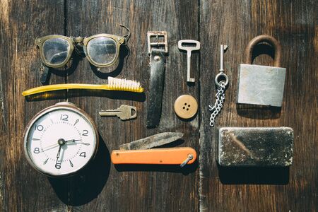 Top view of creative arrangement of vintage old things on wooden deskの写真素材