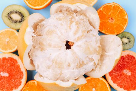 Citrus fruits background orange lemon grapefruit mandarin kiwi. Flatlay compositionの写真素材