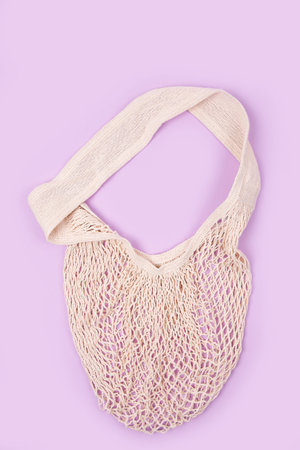 Mesh Tote bag canvas fabric cloth eco shopping sack mockup bag. Grid eco bag for grocery on pink...