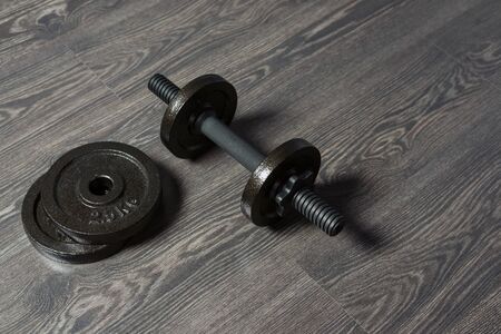 dumbbells on the floor, fitness at home, backgroundの写真素材