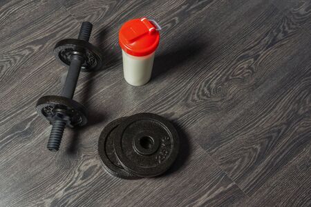dumbbells on the floor, fitness at home, backgroundの写真素材