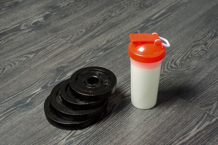 dumbbells on the floor, fitness at home, backgroundの写真素材