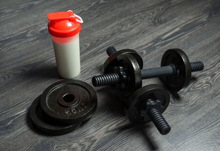 dumbbells on the floor, fitness at home, backgroundの写真素材