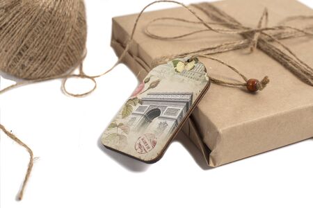 wrapped in kraft paper and tied with a ribbon isolated on white backgroundの写真素材
