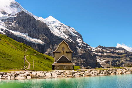 Charming Chilchli (tiny church) at Fallbodensee lake at Jungfrau Eiger Walkのeditorial素材
