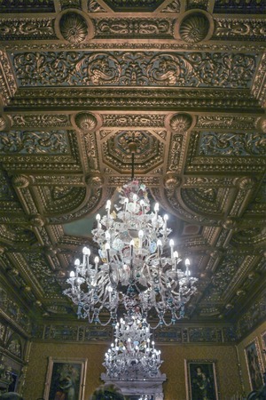 Sinaia, Romania - 2013: Decorative ceiling and chandelier of a room at Peles Castleのeditorial素材
