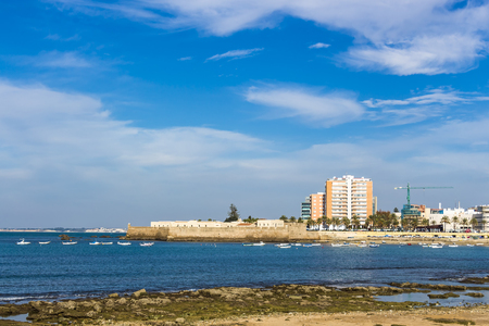 View from Paseo Fernando Quinones in Cadiz. In the distance is the fortress Castillo de Santa Catalinaの写真素材