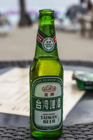 Hengchun, Taiwan - Feb 2019: Chilled bottle of Taiwan Beer at Baisha Beachのeditorial素材