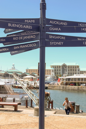 Cape Town - 2011: Signs showing distances to major countries from Victoria Wharf, Cape Townのeditorial素材