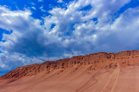 Striking gullies at Flaming Mountains caused by erosion of the red sandstone bedrock give the...