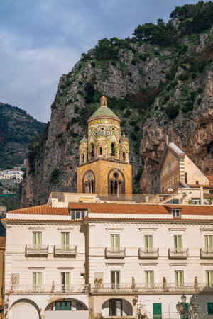 The bell tower of Amalfi Cathedral was constructed between the 12th and 13th centuries, topped by an elaborate crown decorated with marble and majolica in the Arab-Norman styleの写真素材