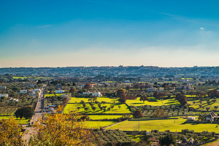 View from Locorotondo panoramic point towards Martina Franca townの写真素材