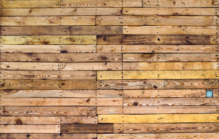 Old wooden planks wall texture. Weathered wooden background. Natural wooden planks with nails at sunlightの写真素材