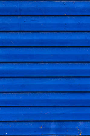 Matt grey painted wooden lining wall. Vertical wooden planks background.の写真素材