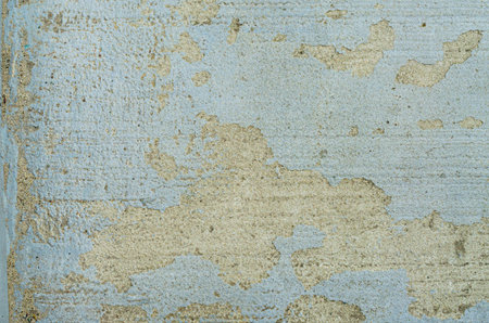 Blue paint dirty plaster wall with worn. Texture of rough surface of old wall with cracks
