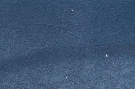 Matt grey painted plywood texture. Grunge black background.の写真素材