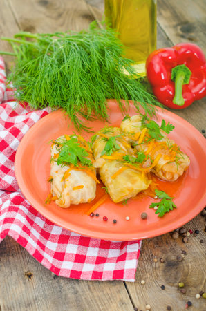 Three delicious stuffed cabbage on a plate. Freshly prepared food on the dining table ready to eat. Large portion of food for energy.の写真素材